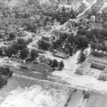 This 1938 image shows the newly built central school, and much of the village.